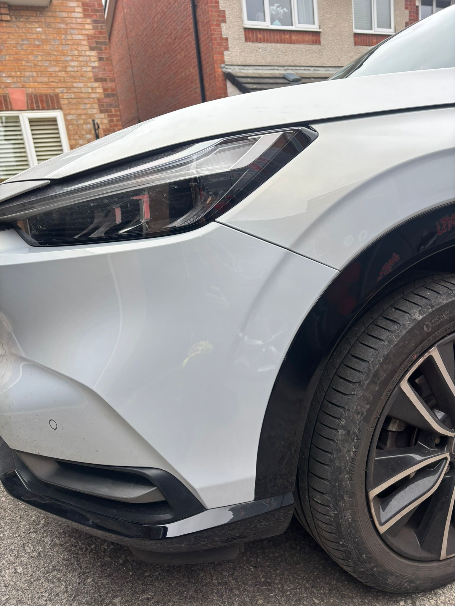 Repaired car bumper showing perfect paint match