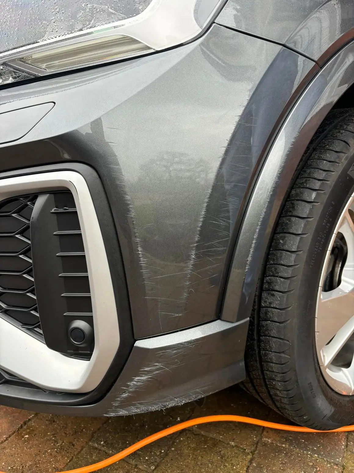 Car bodywork before repair showing scratch damage